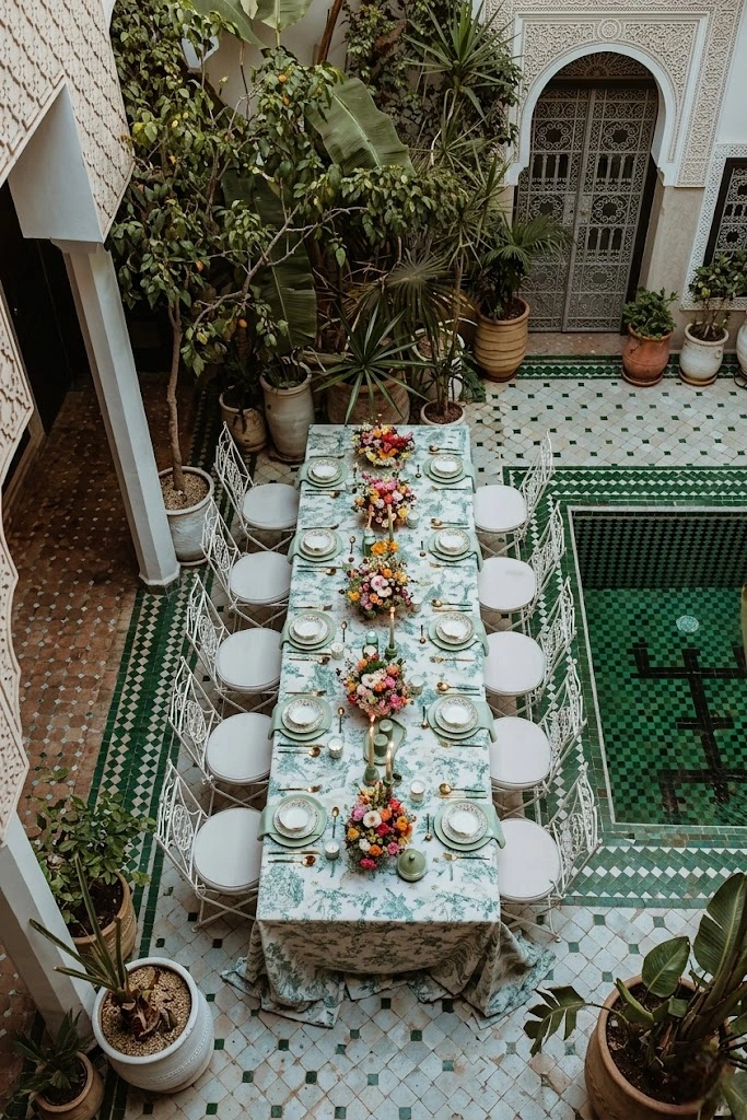 Luxurious Moroccan riad courtyard with arches and fountain